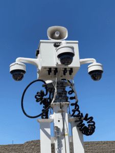 A group of cameras attached to the side of a pole.